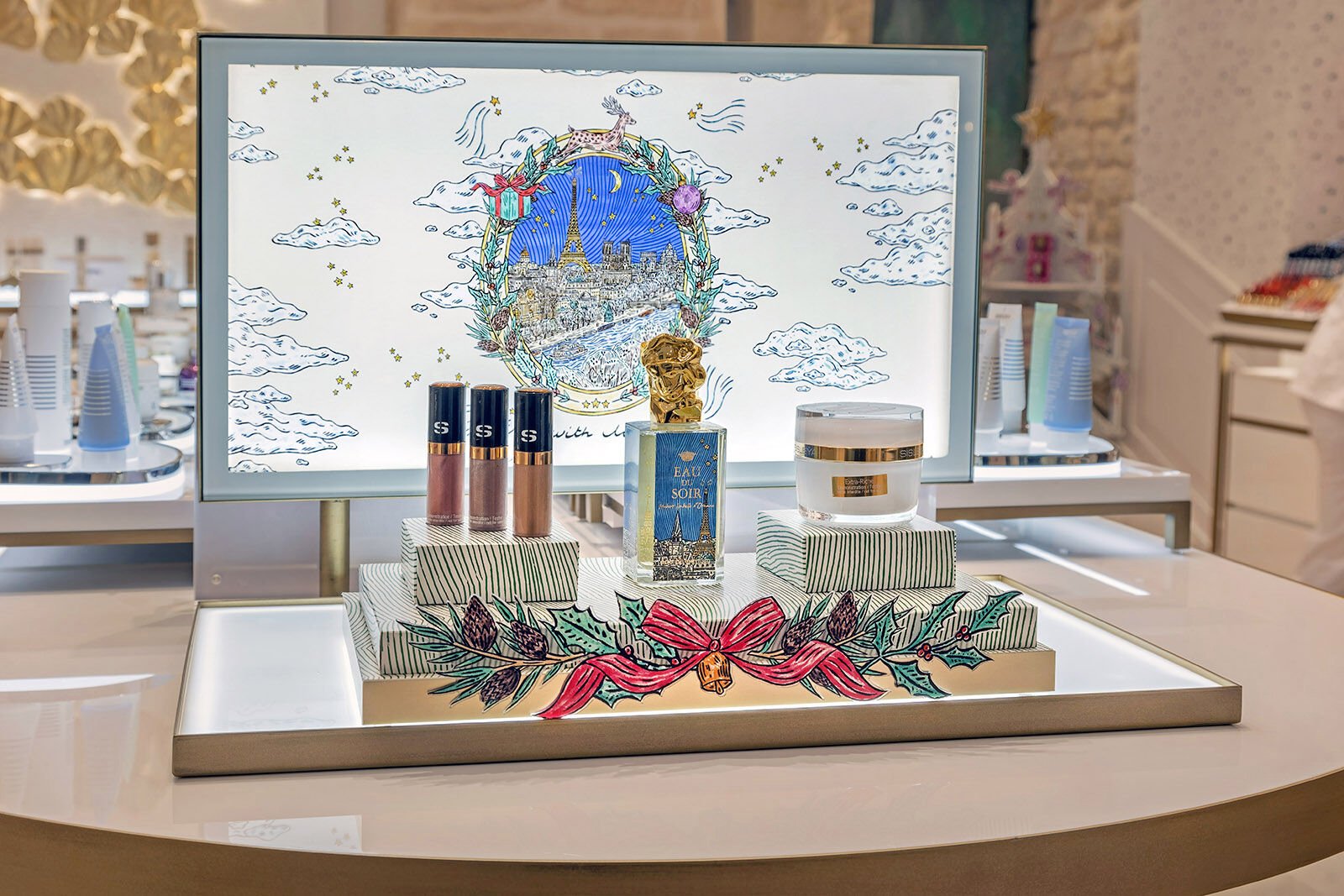 Cosmetics and fragrance countertop display with tiered risers and an illuminated graphic backdrop