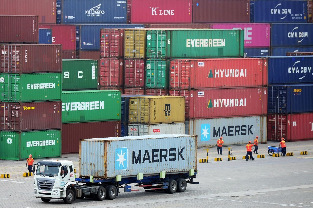 Container truck moving through a shipping container terminal